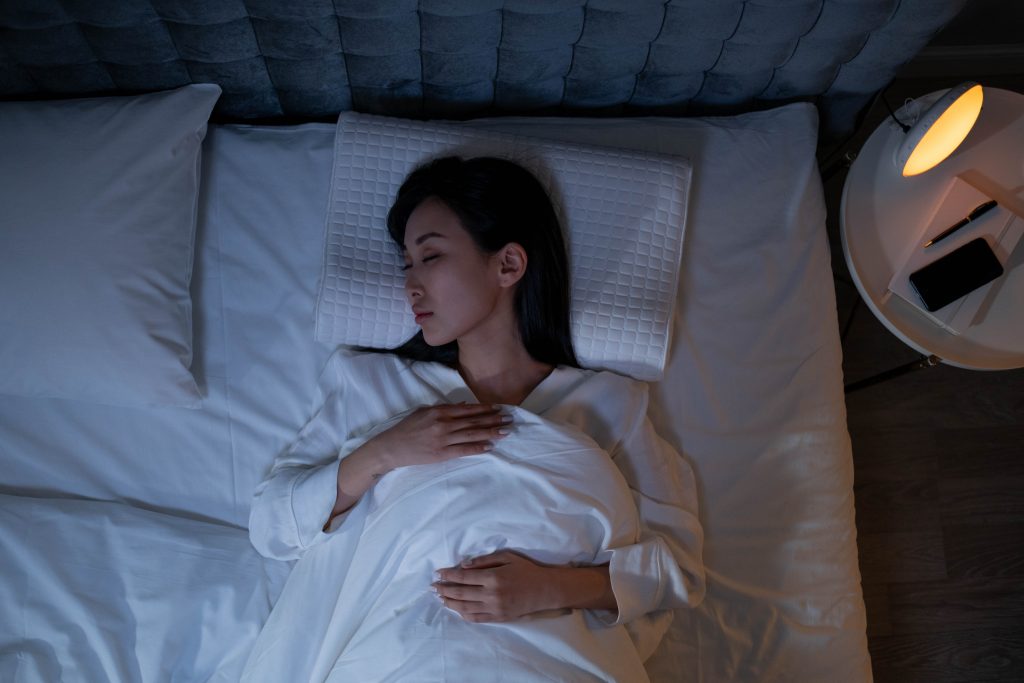 Woman sleeping on bed