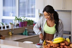 Healthy woman cooking andfollowing a pro metabolic diet