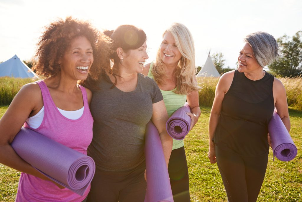 Group,Of,Mature,Female,Friends,On,Outdoor,Yoga,Retreat,Walking