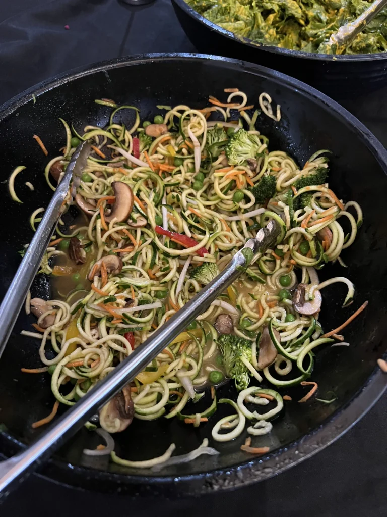 Freshly grown zucchini salads with broccoli, spinach, radishes, and more prepared by Hippocrates wellness center