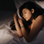 Women wearing a gema fitness tracker, sleeping and having rest.