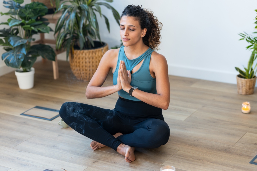 woman doing yoga at home, having of of the 7 types of rest