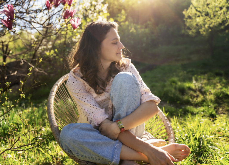 7 types of rest: creative rest, women in a beautiful garden enjoying the end the day alone in nature