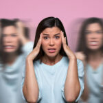 Person holding their head