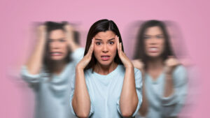 Person holding their head