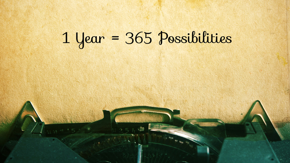 A sentence written on a typewritter "1 year = 365 possibilities"