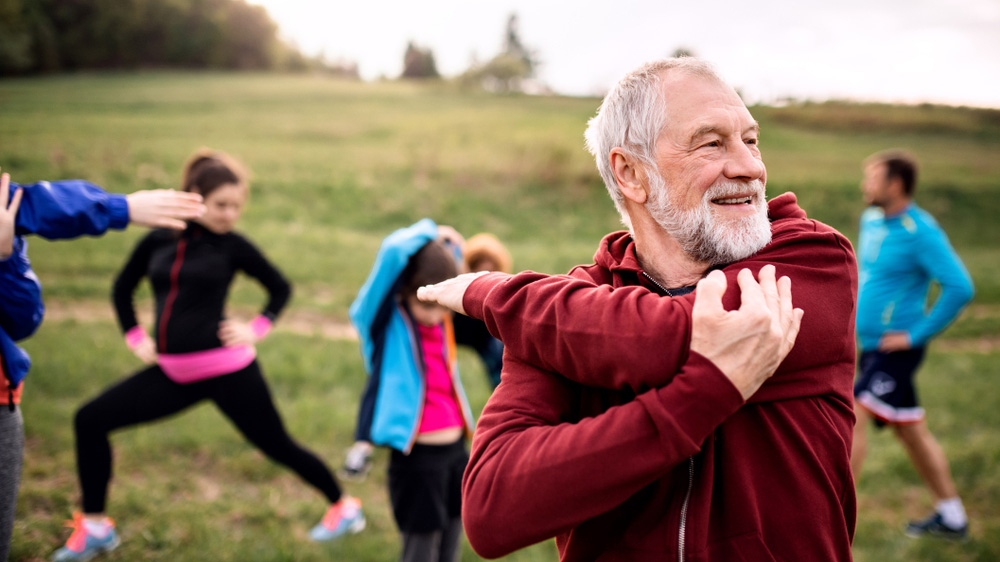 Group of people exercising outside