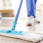 Person mopping the floor